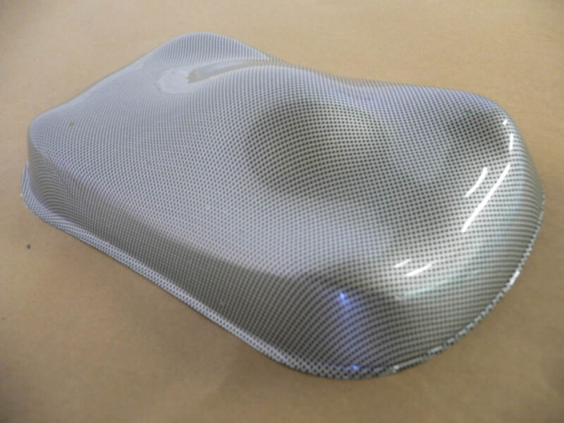 black dot over silver base