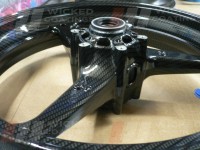 Cross view of carbon dipping on Honda CBR 600 motorcycle wheel
