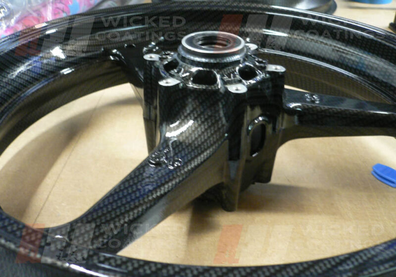 Cross view of carbon dipping on Honda CBR 600 motorcycle wheel