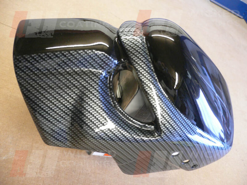 Motorcycle headlamp cover with silver carbon dipping