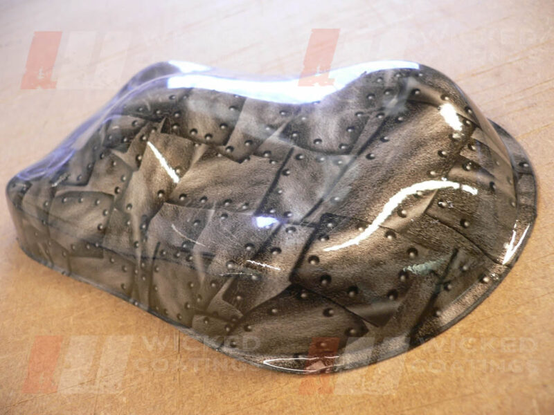 Riveted metal over silver base