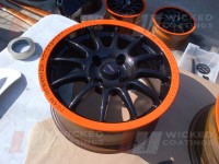 Carbon dipped wheel with bright orange painted rim