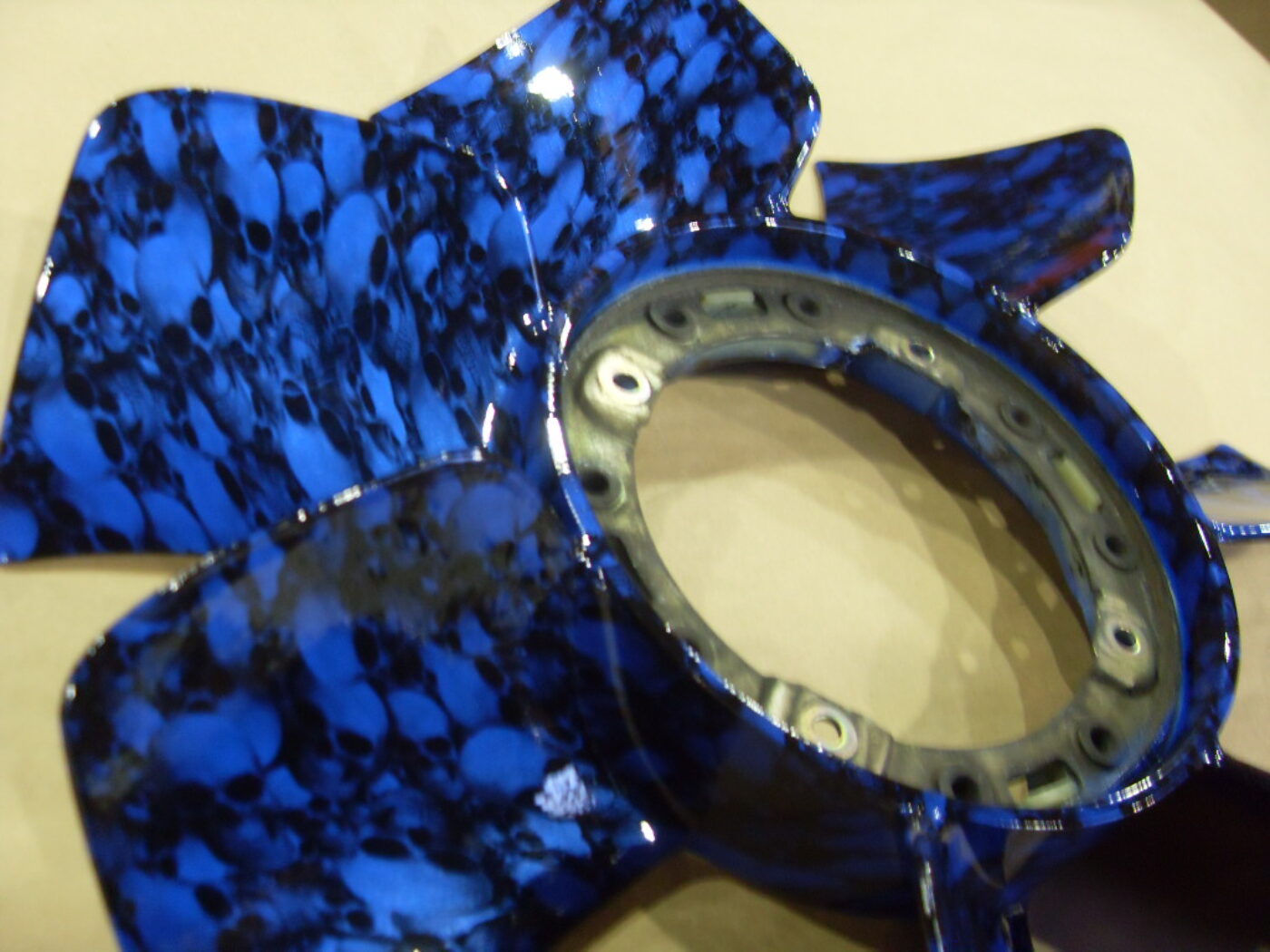 Car engine part in skulls painted blue