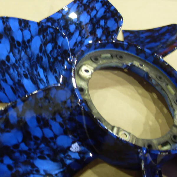 Car engine part in skulls painted blue