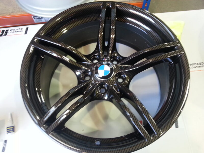 BMW M-Power alloy wheels coated in carbon fibre painted black