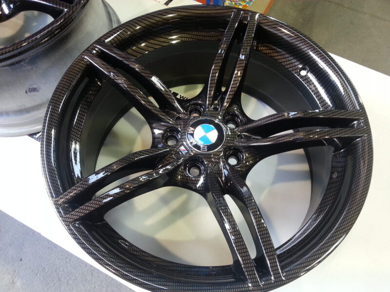 BMW M-Power alloy wheels coated in carbon fibre painted black