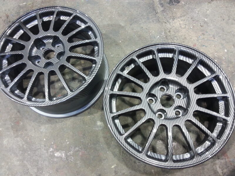 Car alloy wheels coated in carbon fibre painted silver