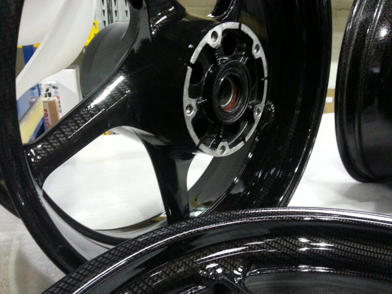 Motorbike wheels coated in carbon fibre