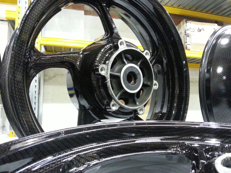 Motorbike wheels coated in carbon fibre