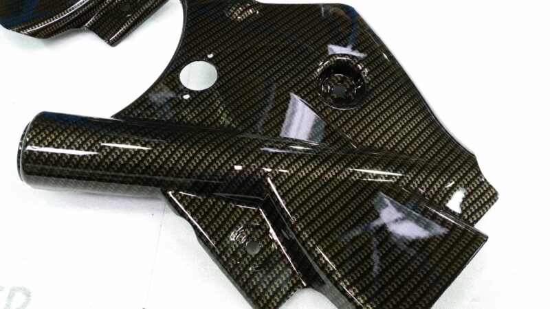 Car interior elements coated in carbon fibre
