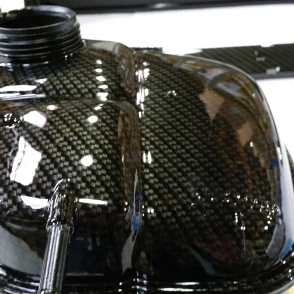 Car engine elements coated in carbon fibre hydrographic film painted black