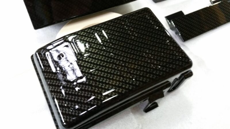 Car engine elements coated in carbon fibre hydrographic film painted black
