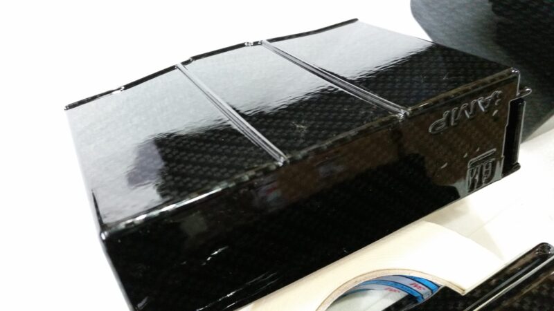 Car engine elements coated in carbon fibre hydrographic film painted black