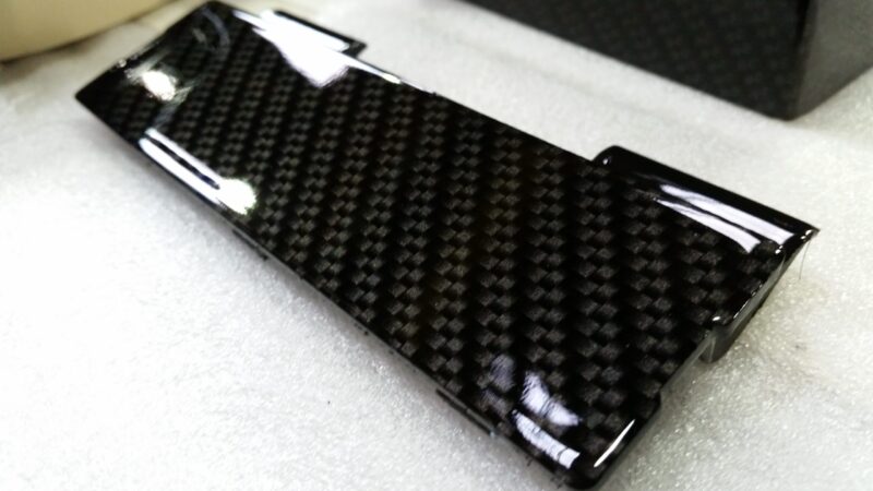 Car engine elements coated in carbon fibre hydrographic film painted black