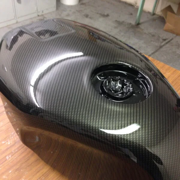 Motorbike parts coated in carbon fibre