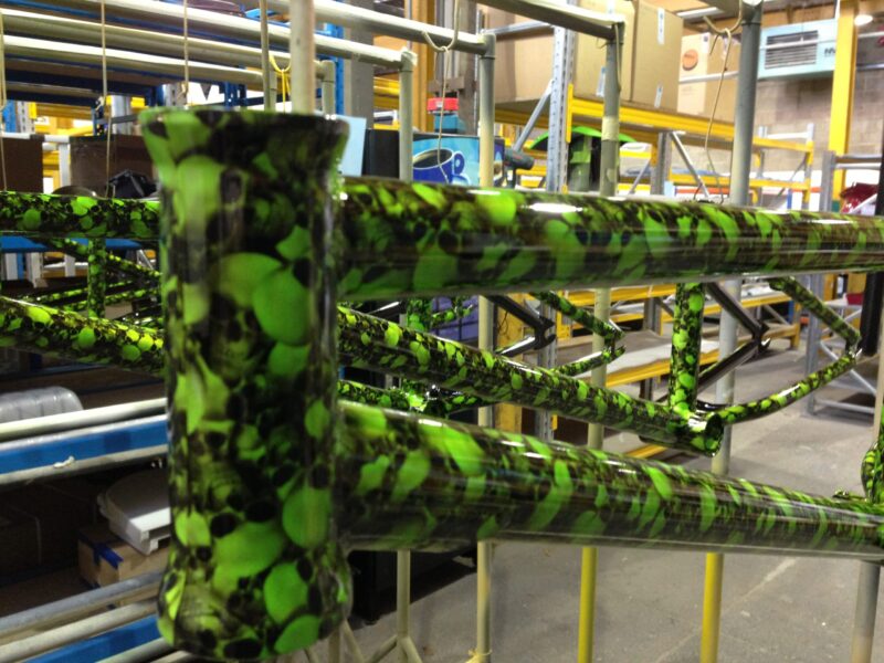 Bike frame coated in skull pattern painted green