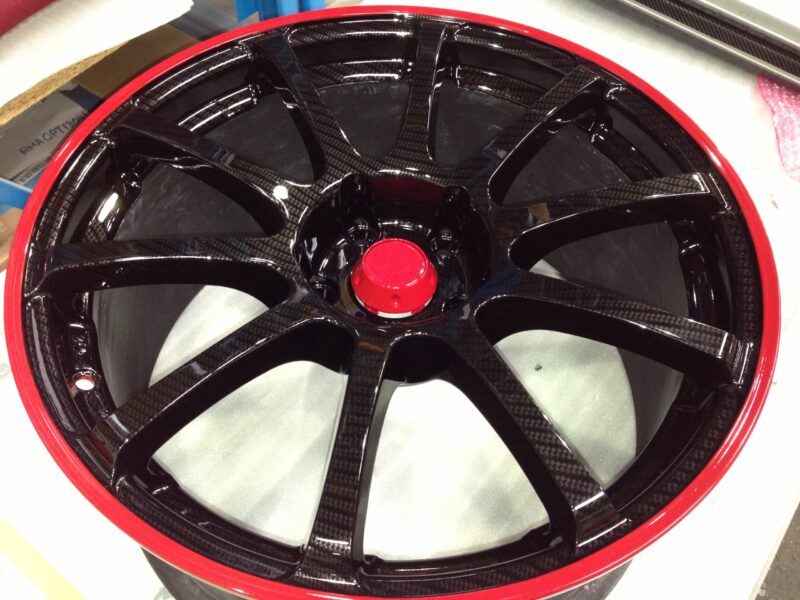 Car Alloy Wheels Coated In Carbon Fibre Painted Black And Red