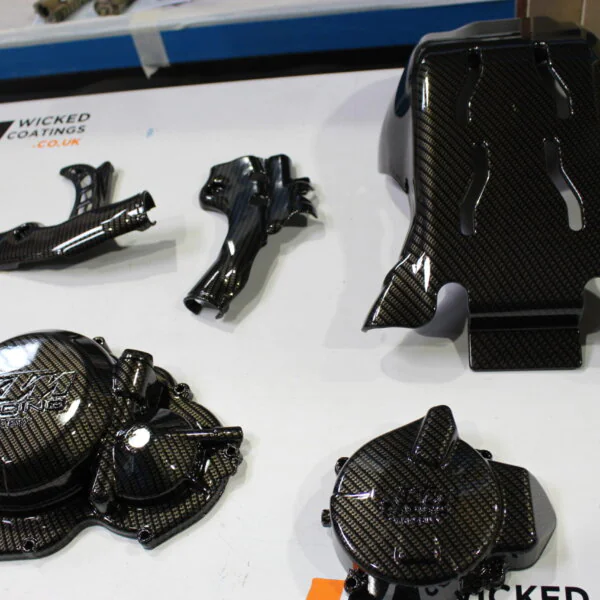 Motorbike engine parts coated in Carbon Fibre hydrographic film