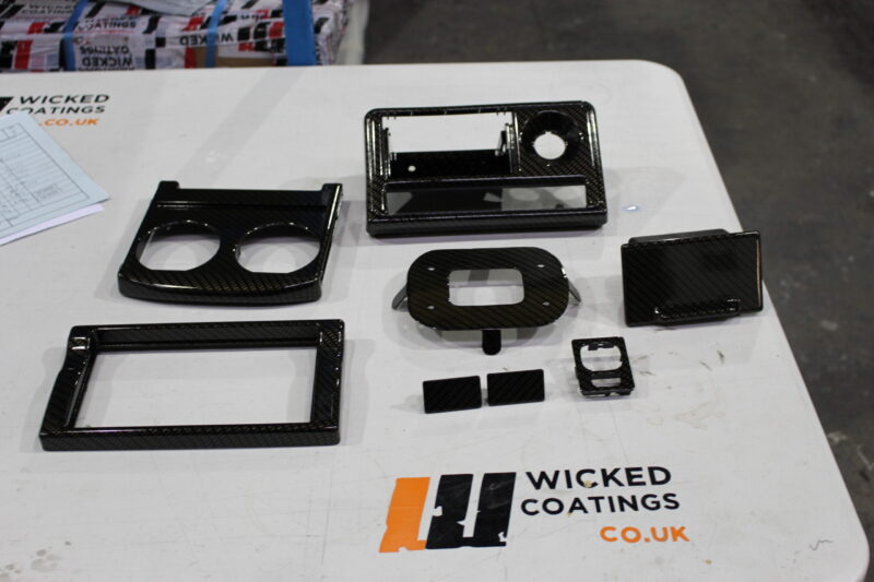 Car dashboard elements coated in carbon fibre