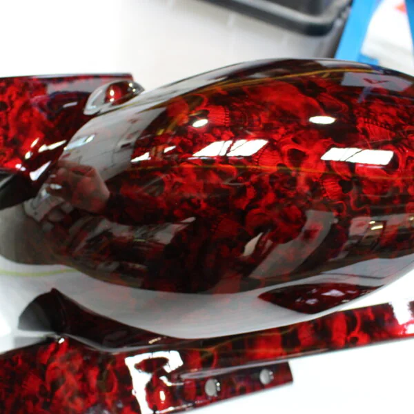 Motorbike parts coated in skull pattern painted red