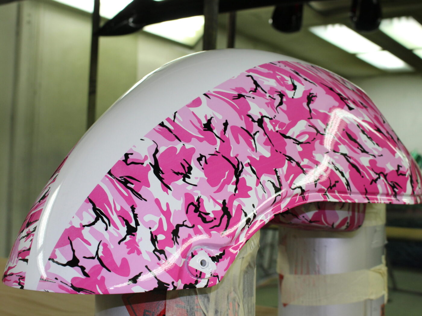 Motorbike tank painted in white, coated in fancy como hydrographic film.