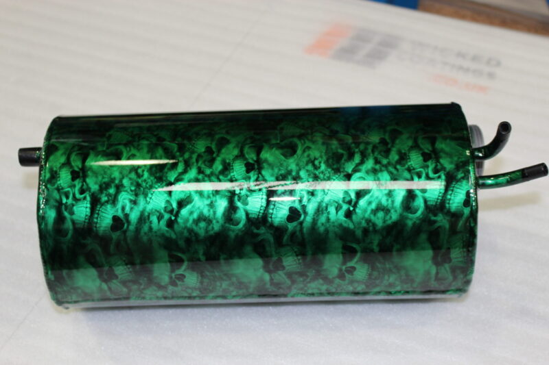 Exhaust coated in skull pattern painted green