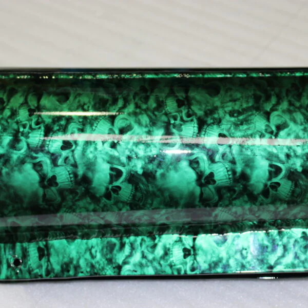 Exhaust coated in skull pattern painted green