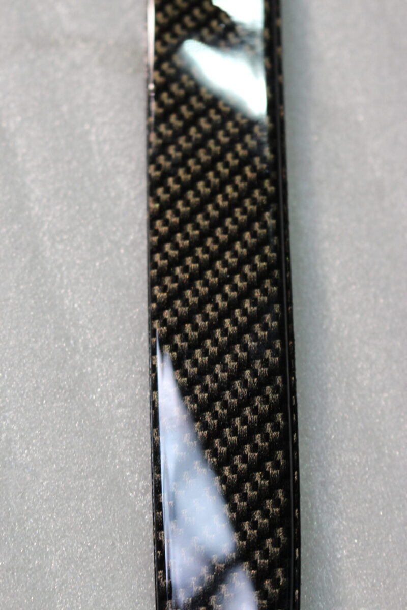 Car exterior element coated in carbon fibre