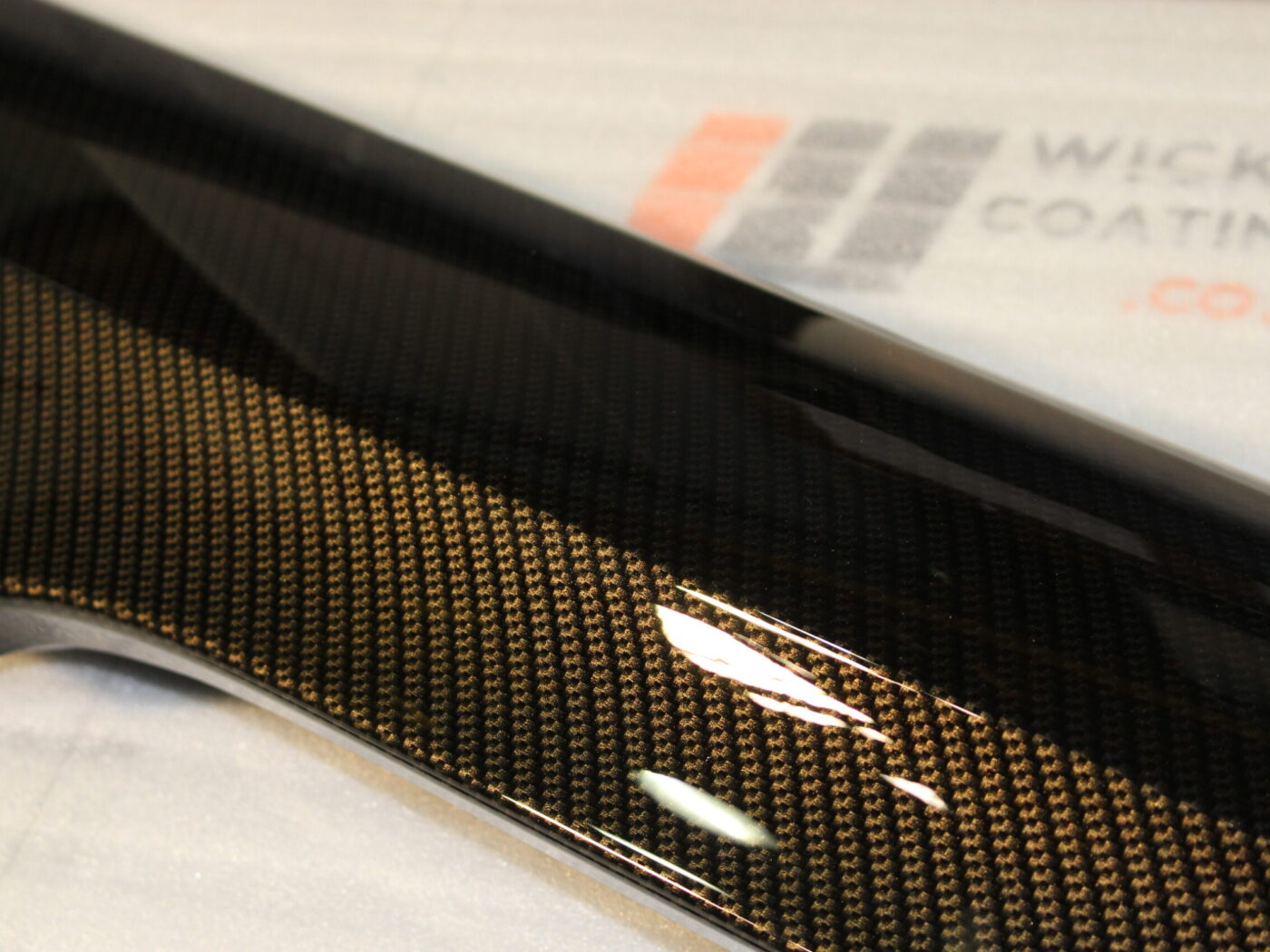 Car exterior element coated in carbon fibre