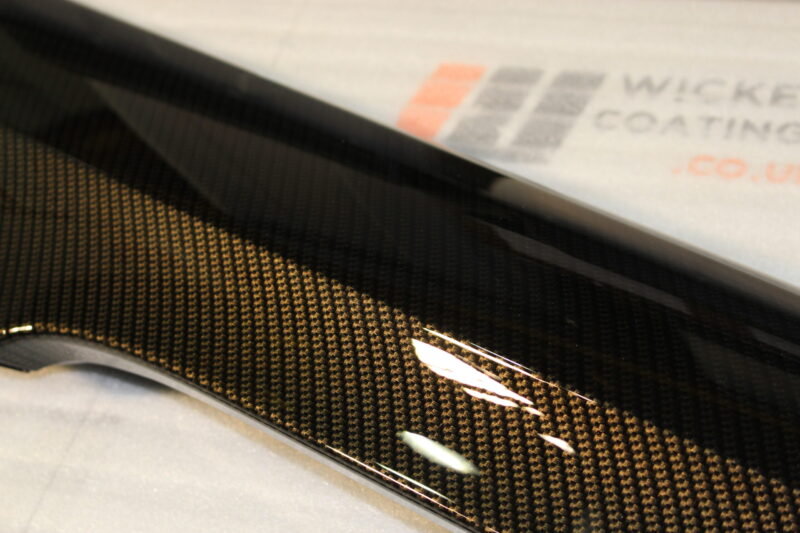 Car exterior element coated in carbon fibre