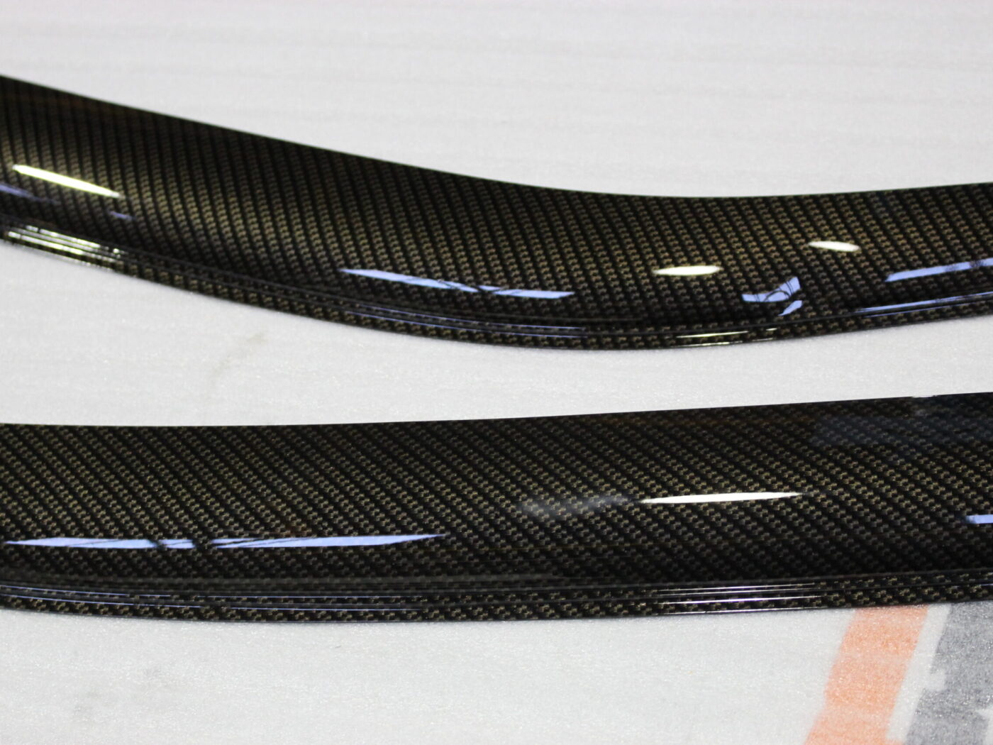 Car exterior element coated in carbon fibre