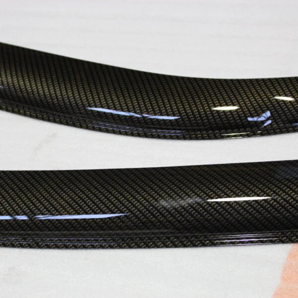 Car exterior element coated in carbon fibre