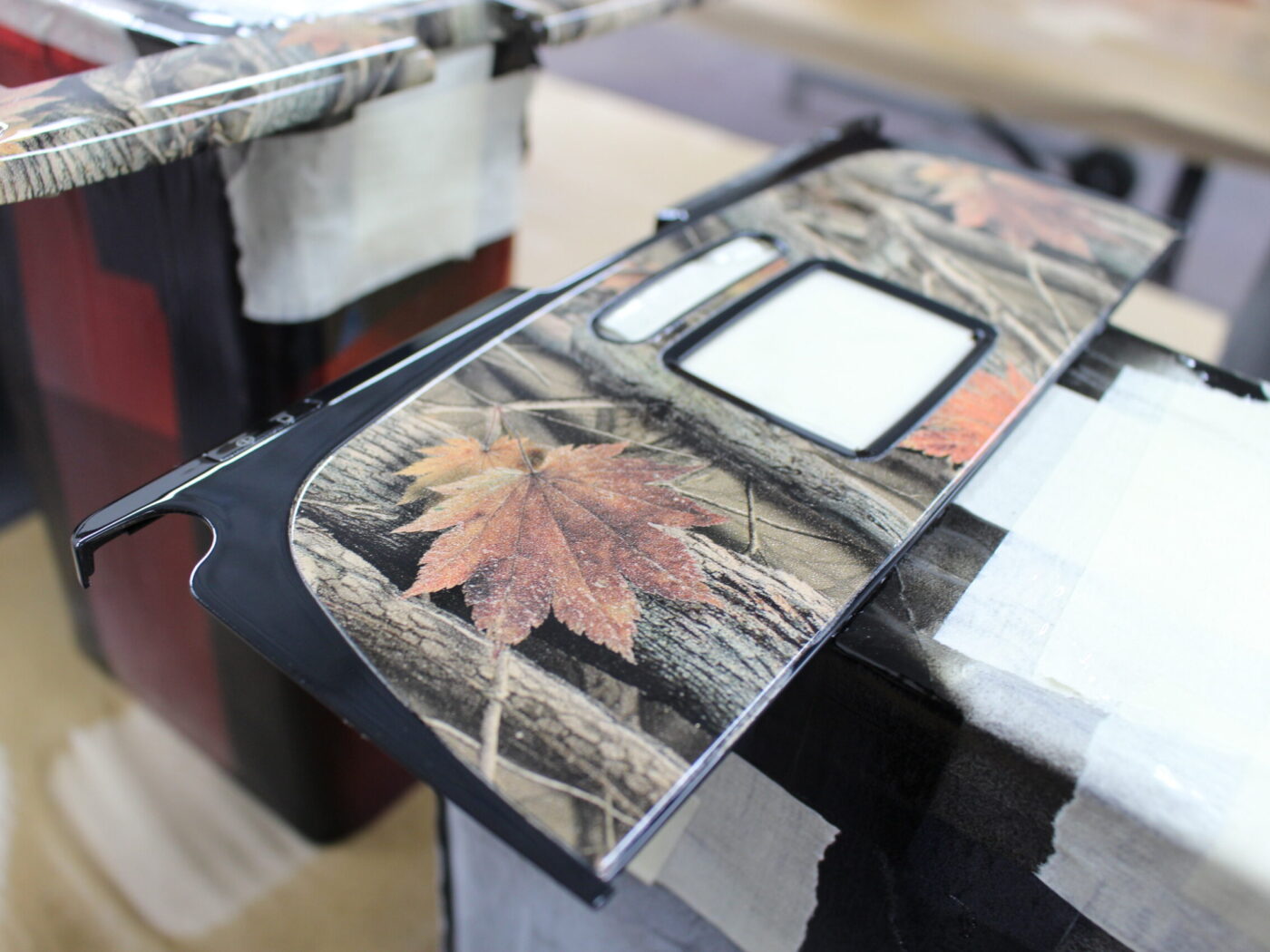Parts of dashboard coated in camouflage hydrographic film