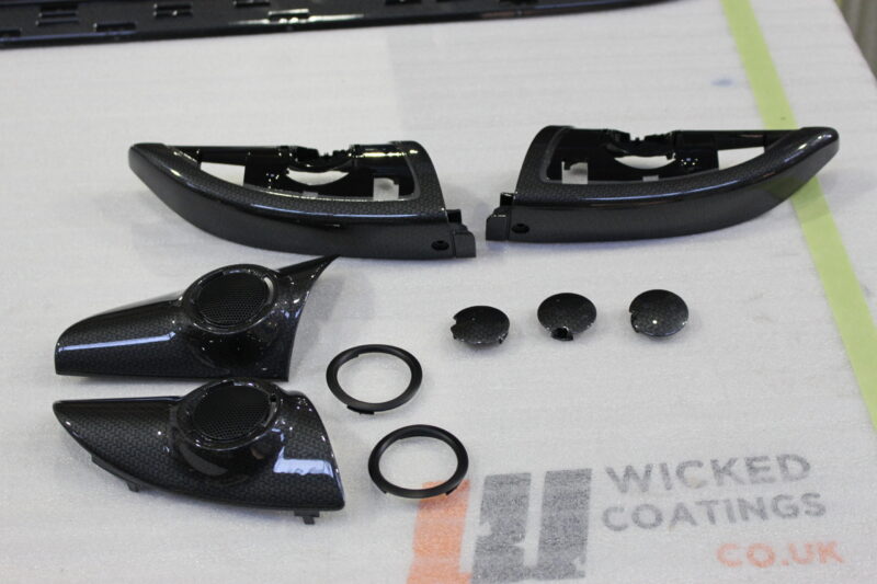 Car interior elements coated in carbon fibre