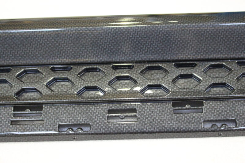 Car interior elements coated in carbon fibre