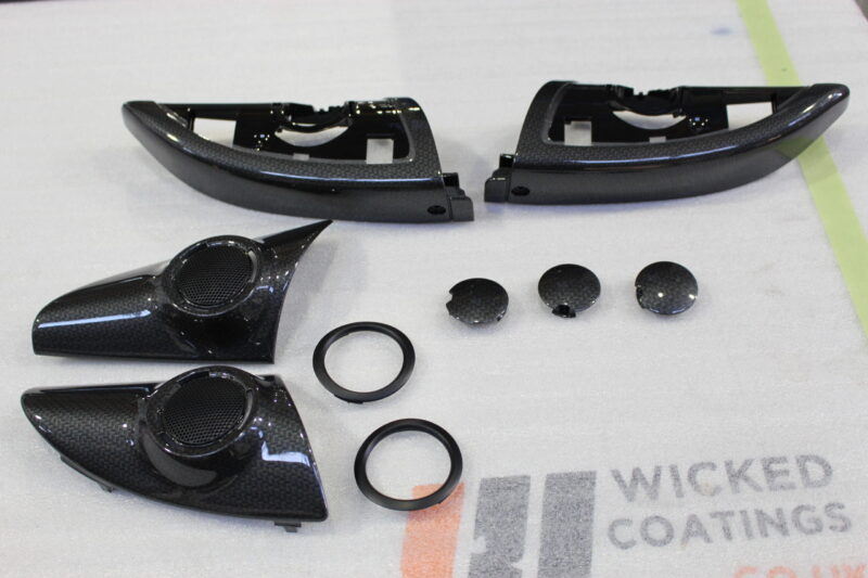 Car interior elements coated in carbon fibre