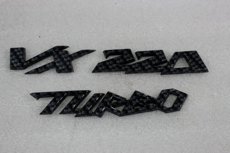 Vauxhall VX 220 Turbo badge coated in carbon fibre
