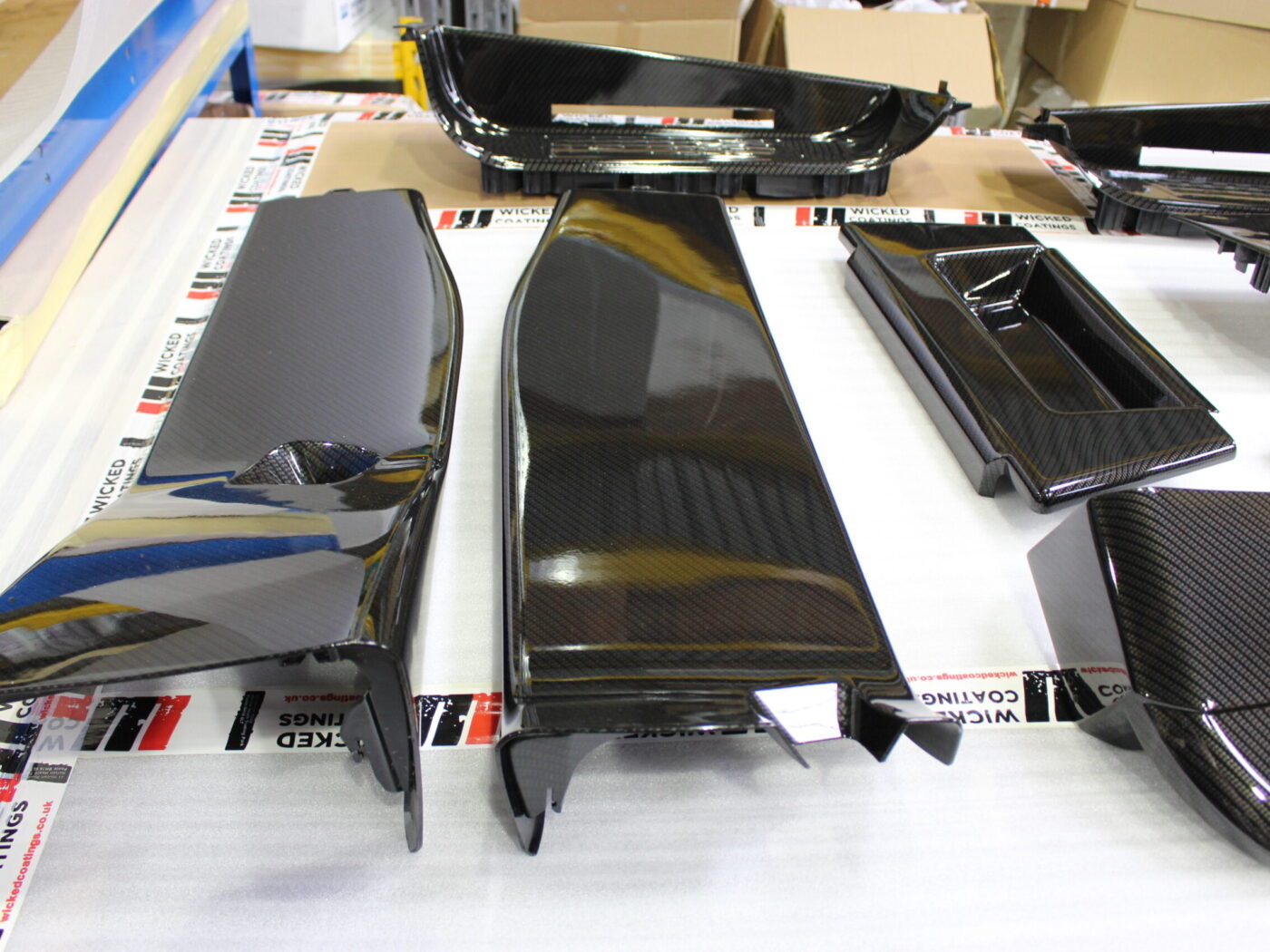 Car interior elements coated in carbon fibre