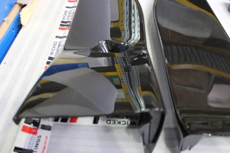 Car interior elements coated in carbon fibre
