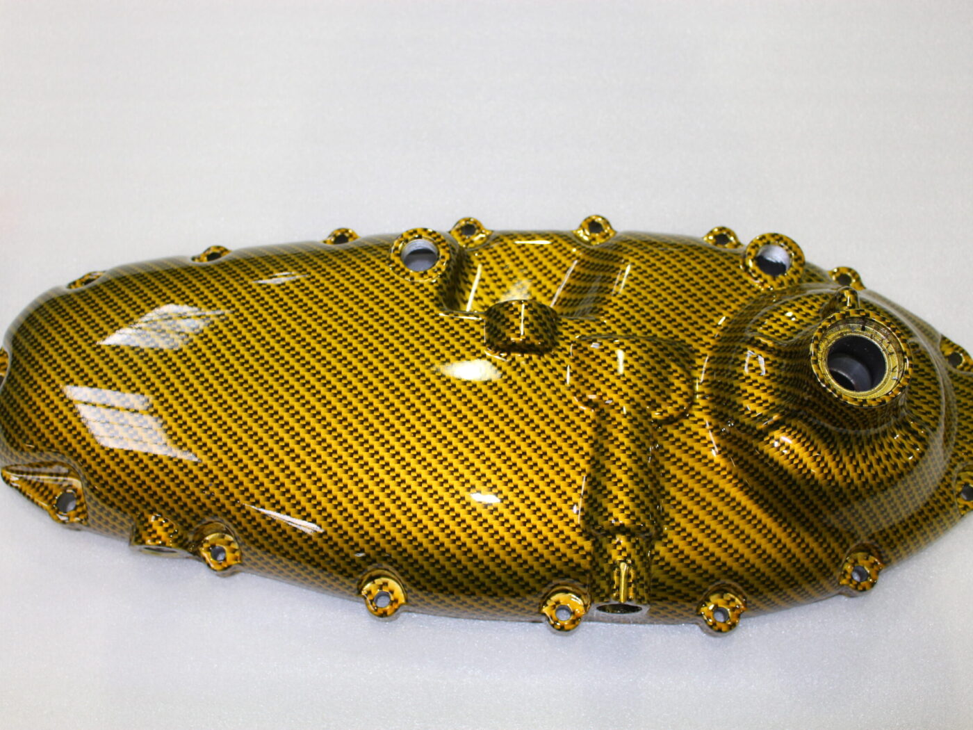 Motorbike parts coated in carbon fibre painted gold