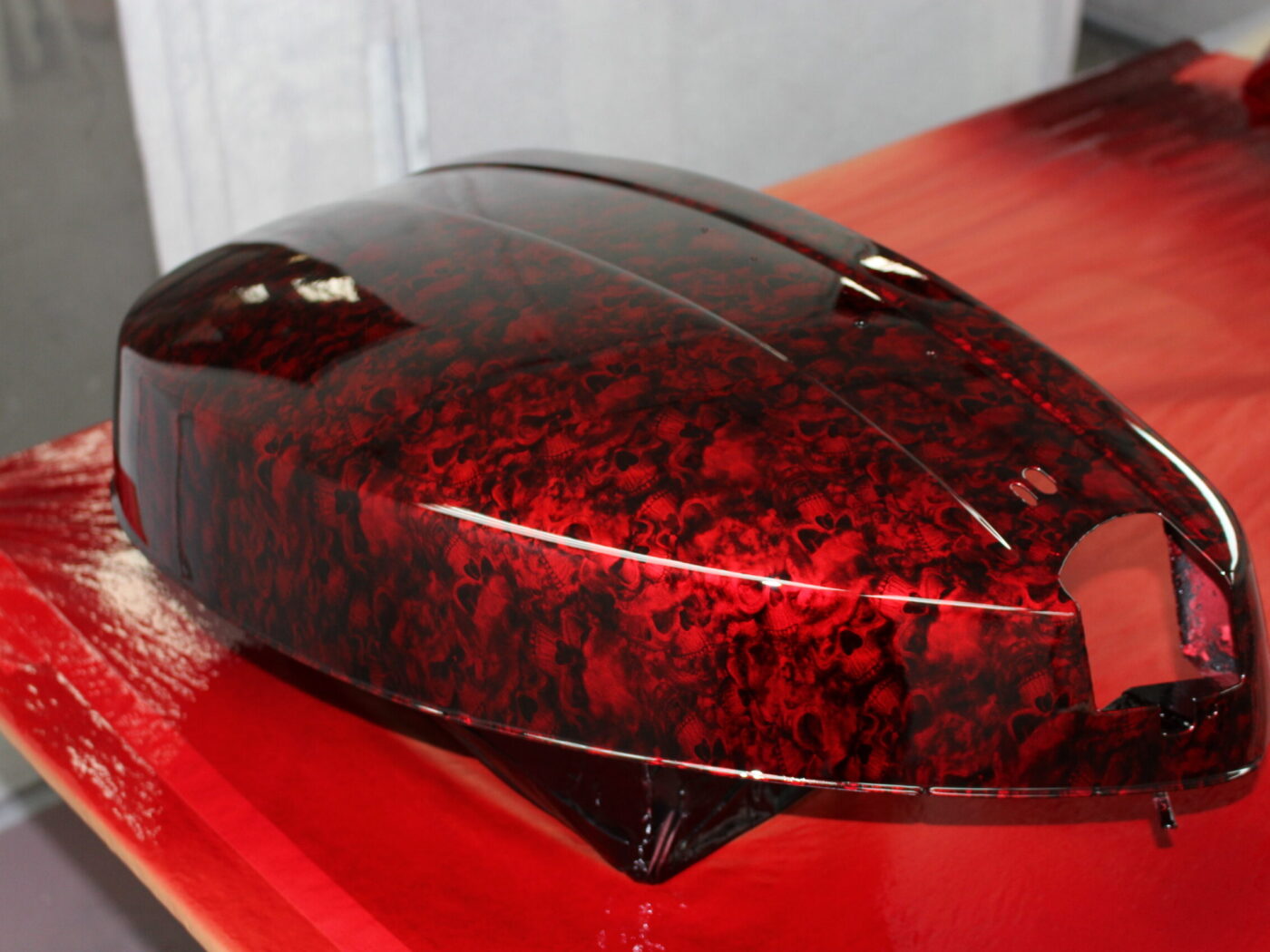 Motorbike parts coated in skulls painted red
