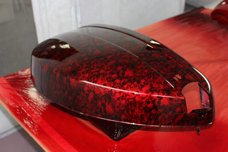 Motorbike parts coated in skulls painted red
