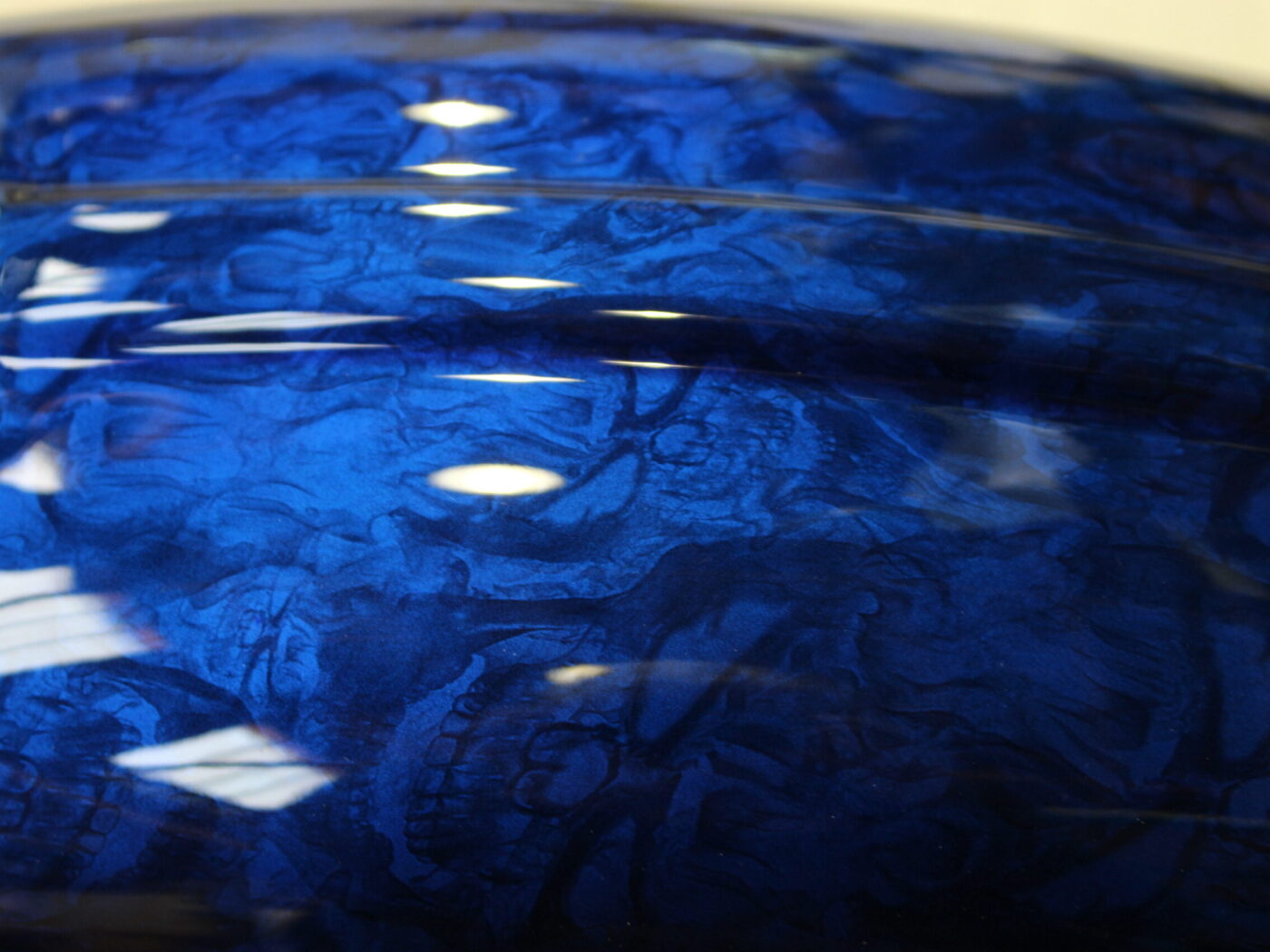Motorbike parts coated in skulls painted blue