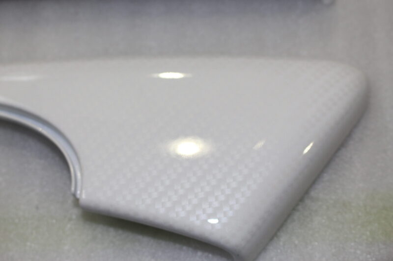 Parts of car interior coated in carbon painted white