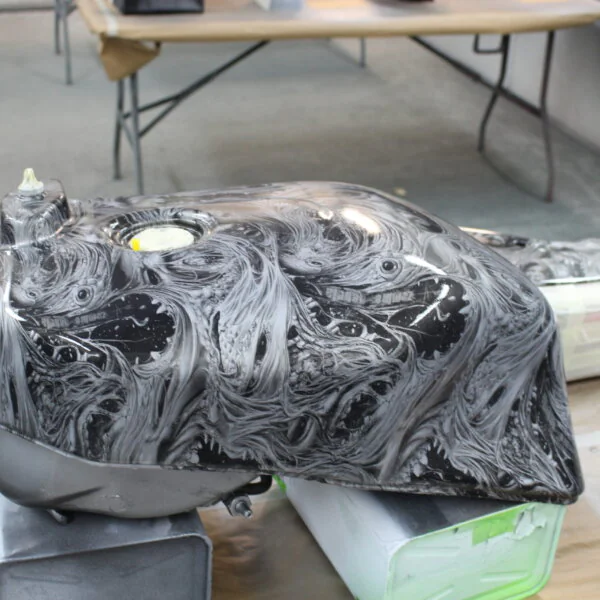 Motorbike parts coated in horror theme hydrographic film