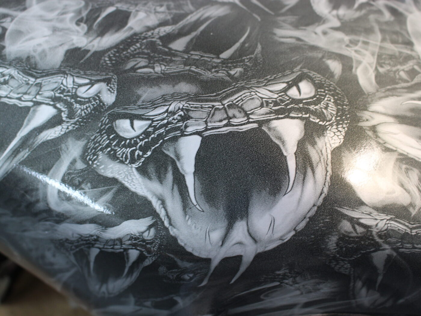 Motorbike tank coated in snakes