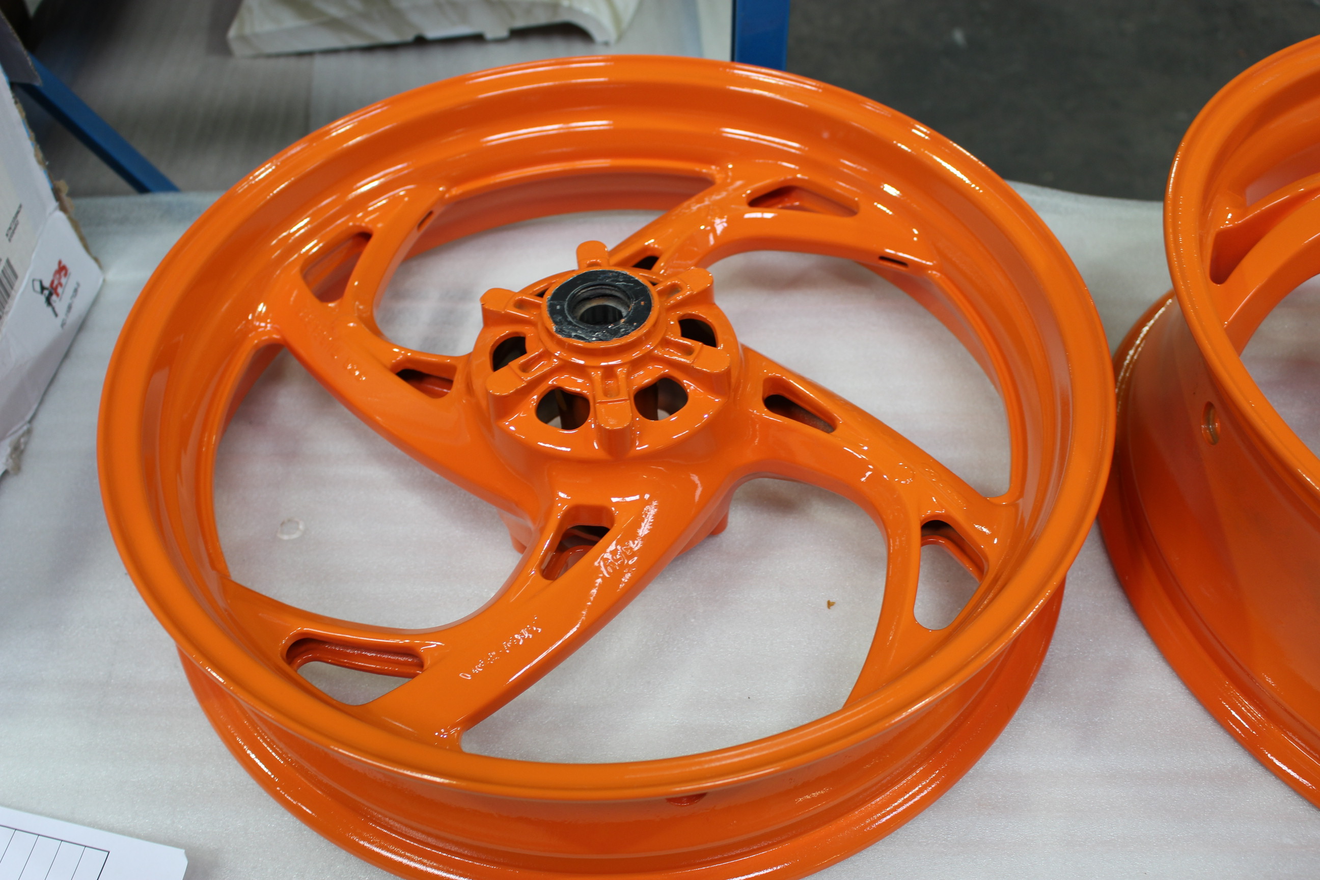 Motorbike alloy wheels painted orange