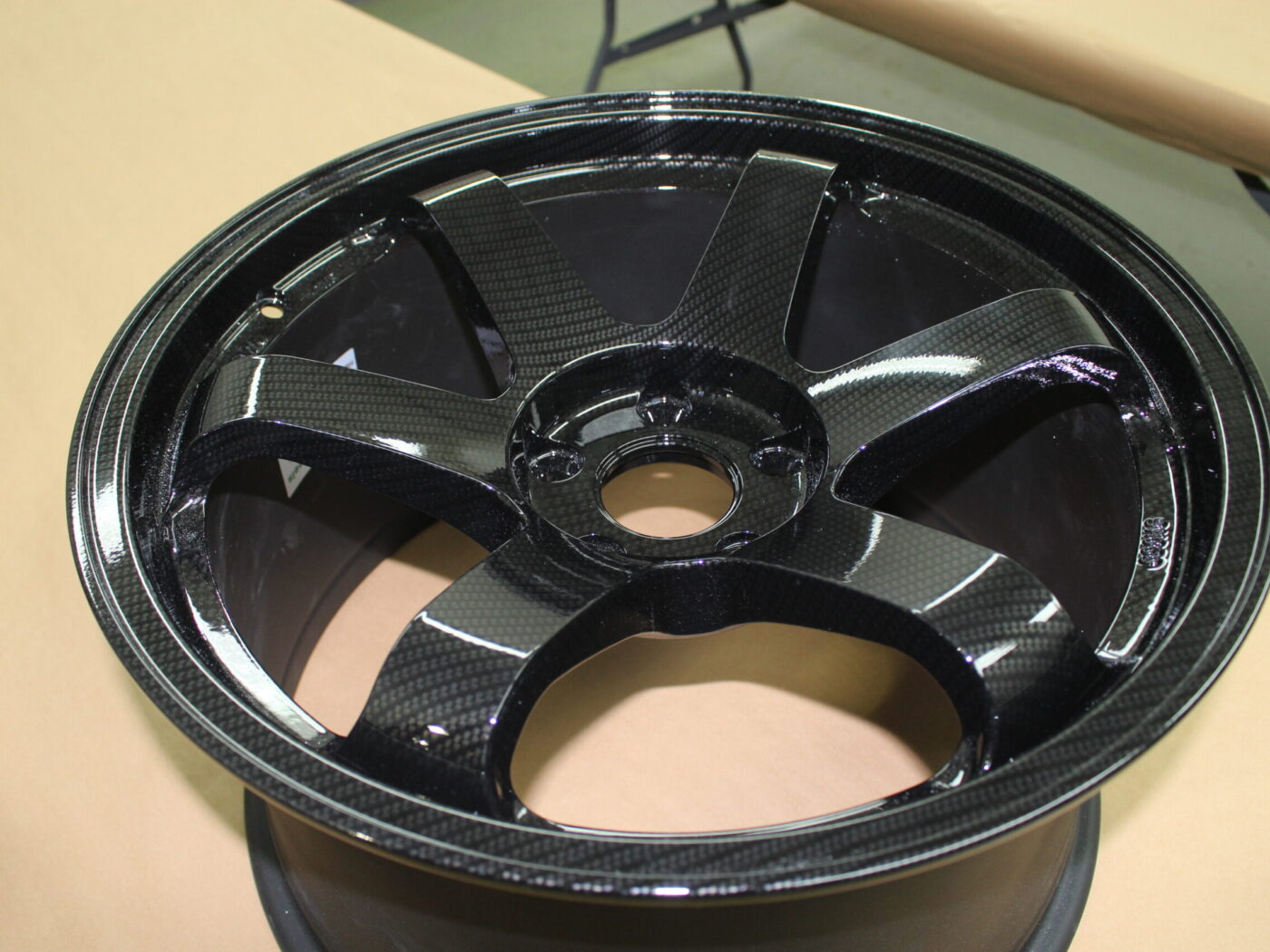 Car alloy wheels coated in carbon fibre
