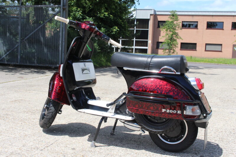 Vespa P200E skuter coated in dark skulls