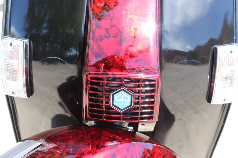 Vespa P200E skuter coated in dark skulls